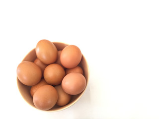 Eggs: brown eggs in separate cups on a white background in close-up shot from top to bottom Thailand