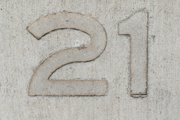 Twenty one number stamped on concrete background