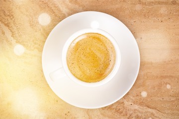 Cup of coffee on wooden background
