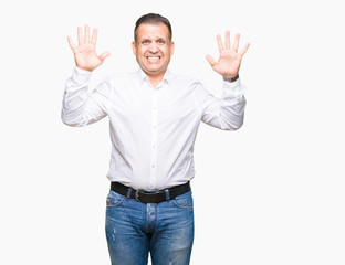 Middle age arab elegant man over isolated background showing and pointing up with fingers number ten while smiling confident and happy.