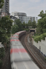 Moving country-cross train for foods supply in quiet city. No sign of life anywhere with film tone