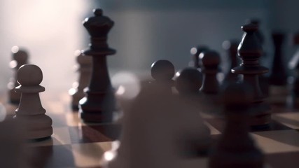 Chess board with wooden pieces. Close-up. Circular movement of the camera, dolly shot.