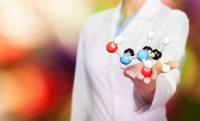Close up of Molecular structure model in hand on background