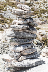 stones laid out in a pyramid on top of a mountain.