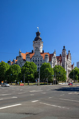 Obraz premium New Leipzig town hall with a big street crossing in the foreground in summery blue sky