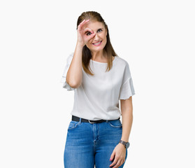 Fototapeta premium Middle age mature beautiful woman over isolated background doing ok gesture with hand smiling, eye looking through fingers with happy face.