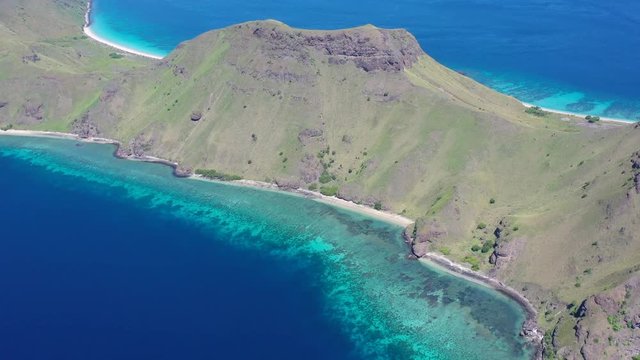 A beautiful coral reef fringes the scenic island of Gili Banta just outside of Komodo National Park. This area of Indonesia is known for its spectacular tropical marine biodiversity.