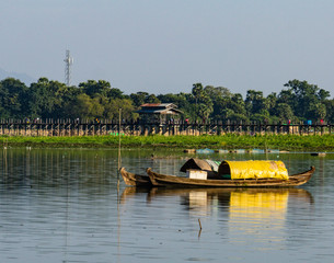 Fototapeta na wymiar two sampan fishing boats on lake in Mandalay, Myanmar