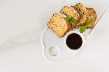 Mediterranean breakfast with carrot cake, cherry and coffee.