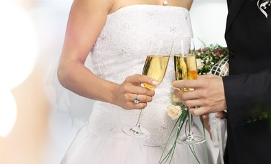 Bride and groom holding stylish bouquet during wedding ceremony