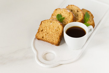 Mediterranean breakfast with carrot cake, cherry and coffee.