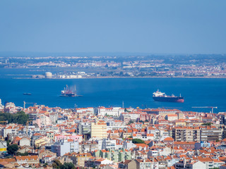Naklejka na ściany i meble Panoramic view over Lisbon and Almada from a viewpoint in Monsanto.