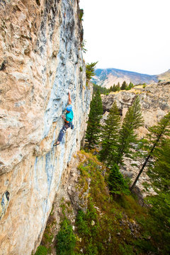 A climber whips out some awesome english on Isla de los Locos (5.13c) at Natural Bridge State Park.