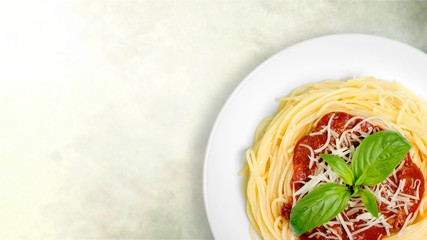 Spaghetti pasta with parsley on  table.