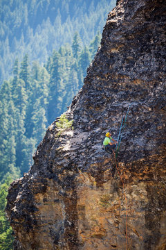 A man rests after topping out on the incredibly overhung 5.11a pitch 3 of the Turkey Monster, a 350+ foot four-pitch spire at the Menagerie in central Oregon.  The formation is the free-standing remnant of ancient lava tubes and is climbed usually only once a year because of the loose rock. The pictured route, the Dod Route, is normally just an aid climbing route because of the volatile nature of the rock. Wallace and Bekah Herndon free climbed the monster.