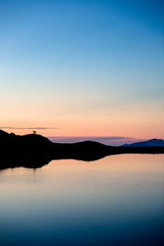 Allg&permil;u, Bavaria, Germany: A group of three hikers enjoying the sunset.