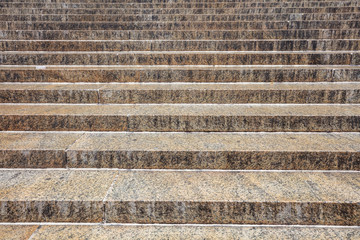 Granite material stairs background, texture. Gray yellow color