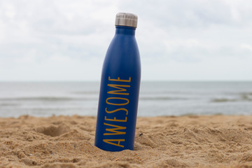 Water bottle on the beach