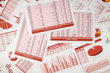 Flat top view of business workspace - reports with data, tables and analytic chart. Business...