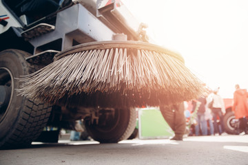 Close-up sweeper machine cleaning. Concept clean streets from debris