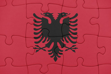 Fototapeta premium puzzle with the national flag of albania.
