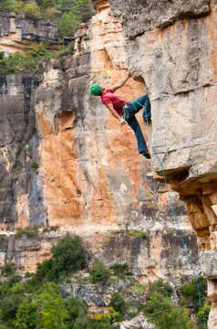 A man on the seemingly-sandbagged, slightly-loose, little-climbed-but-extremely-aesthetic Baby Boom (7a) in Siurana, Catalonia in Spain.