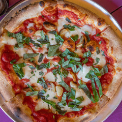 Full frame image of spinach and cheese wood fired pizza