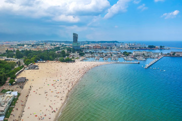 People on the beach at Baltic Sea in Gdynia, Poland.