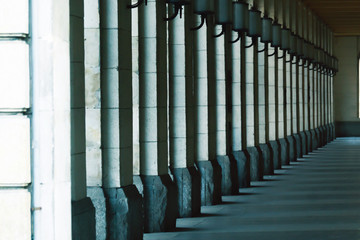 square columns stand in a row. Architecture