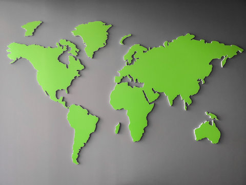 Green World map representing environmental global goals - map picture isolated on a gray gradient background