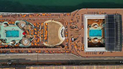 Aerial top view of cruise ship docked in Mediterranean destination