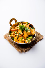 Mix vegetable curry - Indian main course recipe contains Carrots, cauliflower, green peas and beans, baby corn, capsicum and paneer/cottage cheese with traditional masala and curry, selective focus