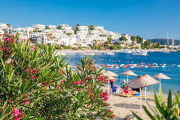 View of Bodrum Beach, Aegean sea, traditional white houses, marina, sailing boats, yachts in Bodrum town Turkey. 