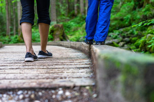 Mother and son walking on a trail