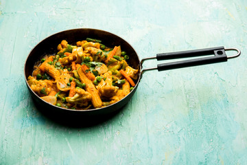 Mix vegetable curry - Indian main course recipe contains Carrots, cauliflower, green peas and beans, baby corn, capsicum and paneer/cottage cheese with traditional masala and curry, selective focus