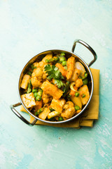 Mix vegetable curry - Indian main course recipe contains Carrots, cauliflower, green peas and beans, baby corn, capsicum and paneer/cottage cheese with traditional masala and curry, selective focus