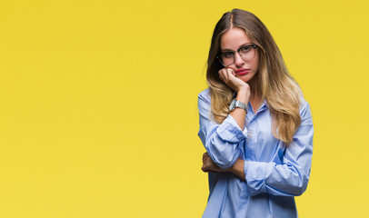 Young beautiful blonde business woman wearing glasses over isolated background thinking looking tired and bored with depression problems with crossed arms.