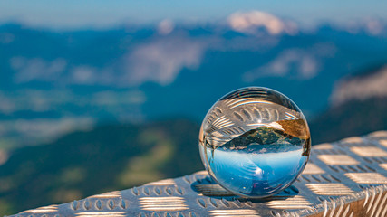Crystal ball alpine landscape shot at Hohe Salve summit - Söll - Tyrol - Austria