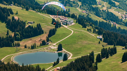 Beautiful alpine view with a paraglider at Hohe Salve summit - Söll - Tyrol - Austria