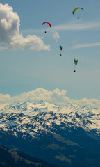 Fototapeta na wymiar Beautiful alpine view with paragliders at Hohe Salve summit - Söll - Tyrol - Austria