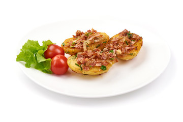 Baked loaded potatoes with bacon, close-up, isolated on white background