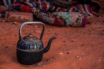 Close up view of a berber teapot on the Sahara's sand.. , Essaouira, Morocco.