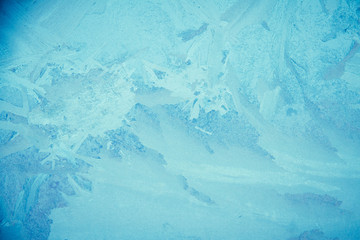 An icy, frost background image.  In this image, you can see the unique patterns created when frost forms on glass.