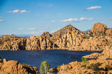 Fototapeta na wymiar The rugged beauty of Watson Lake in Prescott Arizona. This reservoir is surrounded be weathered cliffs of the Granite Dells and blear blue skies.