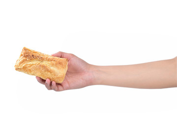 puff pastry in female hand isolated on white background