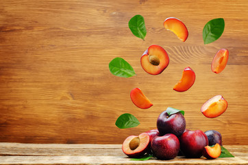 plums with flying slices