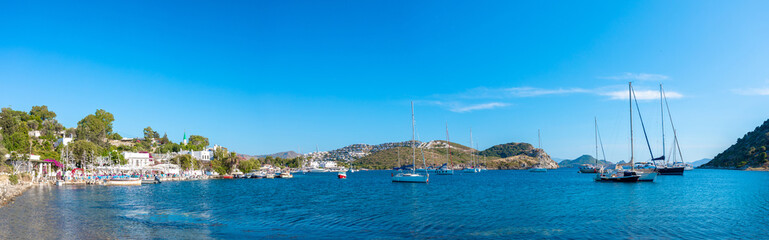 View of Bodrum Beach, Aegean sea, traditional white houses, marina, sailing boats, yachts in Bodrum...