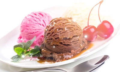 Colorful ice cream balls with berries on white background