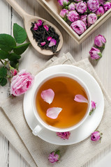 Cup of tea with rose petals