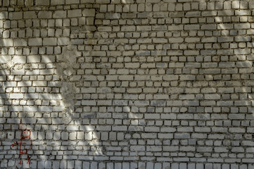 old brick wall on a sunny summer day art texture